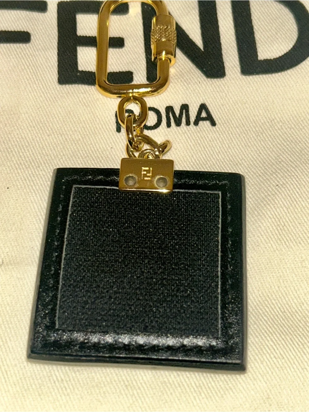 Fendi square leather keychain or Bag Charm.  Full Inclusion.  Vintage and Rare